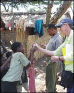 Photo: Holly Williams assesses the residential areas in a Tanzania camp