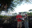 Photo of Joshua Atwood and Danielle Frohlich using a key to identify a non-native palm species.