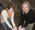 Photo of two students holding hailstones.