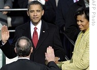 Barack Obama is sworn in as U.S. president by Supreme Court Chief Justice John Roberts; Michelle Obama (R) holds Lincoln Bible, 20 Jan 2009