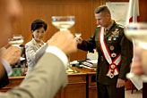 Photo - Japanese Minister of Defense Yuriko Koike, left, offers a toast in honor of U.S. Marine Gen. Peter Pace, right, chairman of the Joint Chiefs of Staff, during a meeting at the Japanese Ministry of Defense Tokyo, Japan, Aug. 17, 2007.  Defense Dept. photo by U.S. Air Force Staff Sgt. D. Myles Cullen