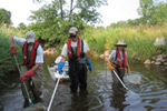  [Photo: USGS scientist working in stream.] 