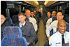 Air Force airmen on Andrews Air Force Base, Md., take their seats on the bus that will transport them to President Barack Obama's inaugural parade, Jan. 20, 2009. DoD photo by Donna Miles