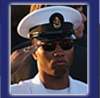 Chief Signalman Nelfreed McCay, from Pageland, South Carolina, salutes as the bugler plays "TAPS" during a sunset interment service in honor of former President Ronald Reagan in Simi Valley, Calif., June 11, 2004. The observance concluded weeklong state funeral services for Ronald Reagan, 40th President of the United States who passed away on June 5, 2004. (U.S. Navy photo by Photographer's Mate 1st Class Arlo K. Abrahamson) VIRIN: 040611-N-5362A-050