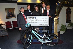 President Proenza accepts a donation from Chase