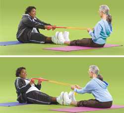 Photo of two women doing buddy stretch exercises