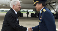 [Click for hi-res] Upon his arrival in Bangkok, Thailand, U.S. Defense Secretary Robert M. Gates, left, shakes hands with Air Chief Marshal Chalit Pookpasuk of the Royal Thai Air Force, June 1, 2008. Defense Dept. photo by U.S. Air Force Tech. Sgt. Jerry Morrison