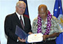 Gates, left, presents the Outstanding Civilian Career Service award to Seikichi Kaneshiro during his retirement ceremony on Anderson Air Force Base, Guam.