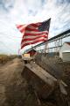 American Flag with holes in it flying in Texas