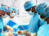 Picture of four surgeons operating