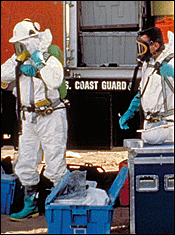 Emergency responders suit up in protective gear to respond to a chemical spill.