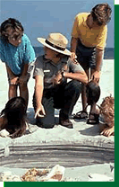 NPS Park Ranger educating some children.