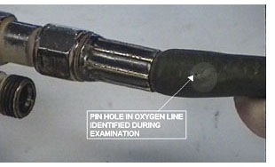 Photo showing pinhole in hose