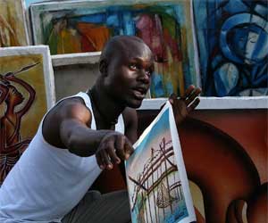 A street vendor sells paintings in Kinshasa, Democratic Republic of the Congo, October 30, 2006. [© AP Images]