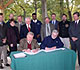 Men signing documents