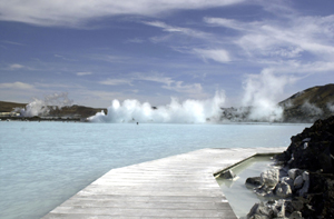 A boardwalk leads to the warm-water Blue Lagoon in Svartsengi, Iceland, May 11, 2002. [© AP Images]