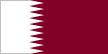 Flag of Qatar is maroon with a broad white serrated band - nine white points - on the hoist side.