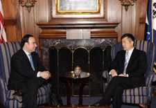 Minister Plata and Secretary Locke talk while seated in chairs. Click for larger image.