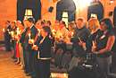 Photo shows first few rows of people holding lit candles and participating in the Candlelight Ceremony held, for NCVRW 2007, indoors at the U.S. Chambers of Commerce.