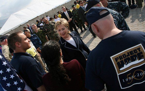 Secretary of State Hillary Rodham Clinton greets Dr. Carla Shonenberg from El Salvador (a volunteer staying on the USNS Comfort) outside of  the Comfort Clinic at Cite Soleil, Haiti.