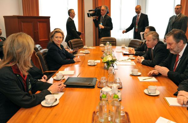 Secretary Clinton in bilateral discussions with NATO Secretary General, Jaap de Hoop Scheffer at the Meetings of NATO Foreign Ministers in Brussels