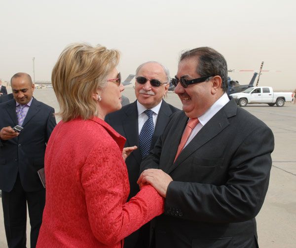 Upon her arrival in Baghdad, U.S. Secretary of State Hillary Rodham Clinton is greeted by Iraqs Minister of Foreign Affairs Hoshyar Zebari.