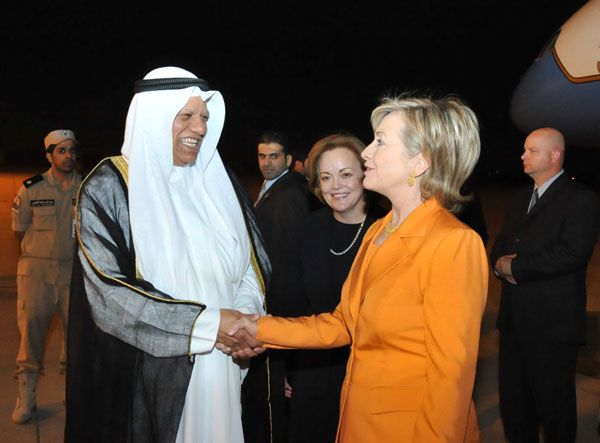 Secretary of State Hillary Rodham Clinton arrives in Kuwait on April 24, 2009 to a welcome from Ambassador Deborah K. Jones [middle] and Kuwaiti MFA Ambassador Ali Al-Sammak [left].