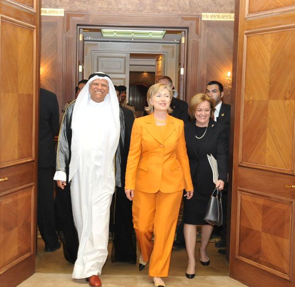 Secretary of State Hillary Rodham Clinton arrives in Kuwait on April 24, 2009 to a welcome from Ambassador Deborah K. Jones [right] and Kuwaiti MFA Ambassador Ali Al-Sammak [left].