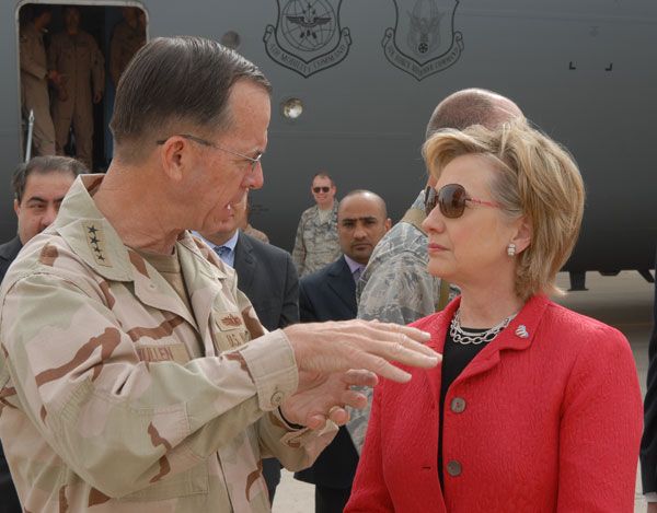 Admiral Michael Mullen briefs Secretary Clinton upon her arrival in Baghdad, Iraq.