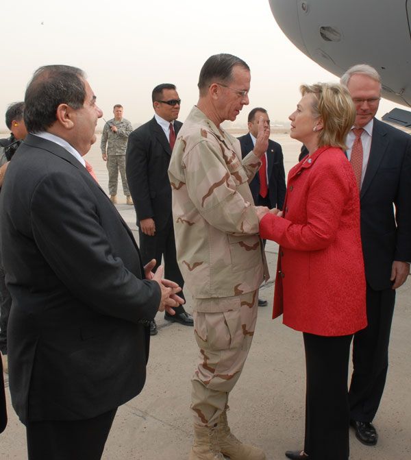 Secretary Clinton greets Admiral Michael Mullen upon her arrival in Baghdad, Iraq as Iraqi Foreign Minister Hoshyar Zebari [to left of Admiral Mullen] looks on, Baghdad, Iraq.