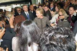 Date: 01/22/2009 Description: 67th Secretary of State Hillary Clinton arrives for her first day at the Department of State greeted by an overflowing lobby of  Department employees in the diplomatic entrance. State Dept Photo