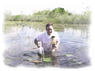 photo of SOFIA scientist collecting samples in the water
