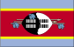 Flag of Swaziland is three horizontal bands of blue (top), red (triple width), and blue; the red band is edged in yellow; centered in the red band is a large black and white shield covering two spears and a staff decorated with feather tassels, all placed horizontally.