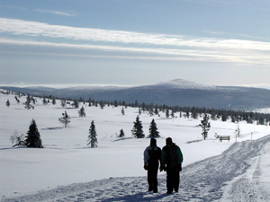 Visitors walk in Pallas-Ounastunturi National Park in Lapland, Finland, March 1, 2002. [© AP Images]