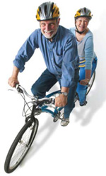 Photo of a couple riding a bike