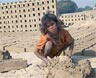 A 9-year-old girl trafficked from Bihar, India, makes bricks under the hot sun. Kay Chernush for the U.S. State Department.