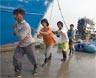 Burmese laborers work in the commercial fishing industry in Thailand. Kay Chernush for the U.S. State Department.