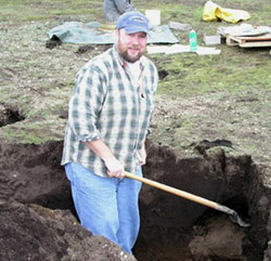 Pete Biggam digging in soil