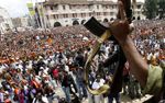 Date: 03/18/2009 Description: Supporters of Andry Rajoelina cheer at a rally in Antananarivo, Madagascar, Wednesday March 18, 2009, as they hear that Madagascar