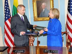 Date: 03/09/2009 Description: Secretary of State Hillary Rodham Clinton and Lithuanian Foreign Minister Vygaudas Usackas prepare to sign documents at the State Department. State Dept Photo