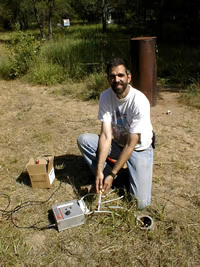 USGS scientist collecting an unsaturated-zone gas sample with a syringe from a vapor sampling well at the Bemidji Crude Oil Spill Research Site, Bemidji, MN. The sample was used to study the natural attenuation of hydrocarbon vapors in the unsaturated zone.