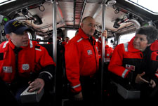 Secretary Napolitano and Coast Guard Commandant Adm. Thad Allen listen to Coast Guard Station New York Petty Officer 2nd Class Donald Robinson talk about driving the Coast Guard's new 45-foot Medium Response Boat in New York Harbor.