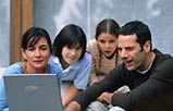 A family using a laptop computer