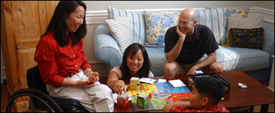 Photo: A family playing a board game