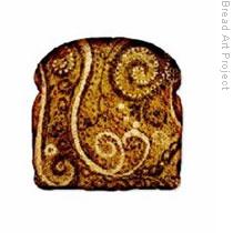 An elaborate pattern decorates this darkened slice of toast in the virtual gallery