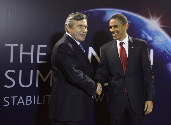 Britain's Prime Minister Gordon Brown, left, greets U.S. President Barack Obama as he arrives for the G-20 summit at the ExCel centre in London, Thursday, April 2, 2009.