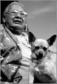 Photo of Nellie Two Bulls with her dog.