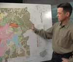 Jake Lowenstern pointing at Yellowstone Map. 