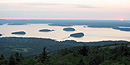 From atop Cadillac Mountain, the sun is just starting to rise over the Porcupine Islands.