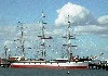 Broadside view of 3 masted vessel